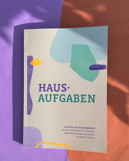 Glücks- und Hausaufgabenheft